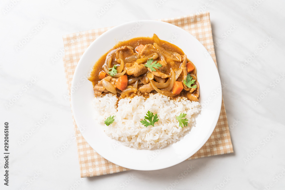 Japanese curry rice with sliced pork, carrot and onions