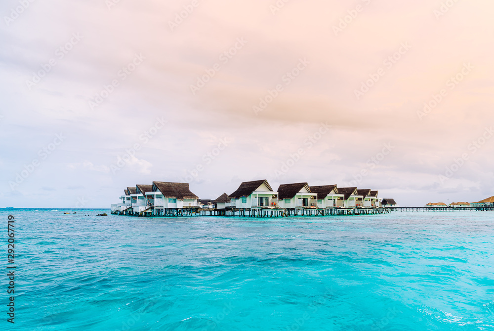 tropical Maldives resort hotel and island with beach and beautiful sky