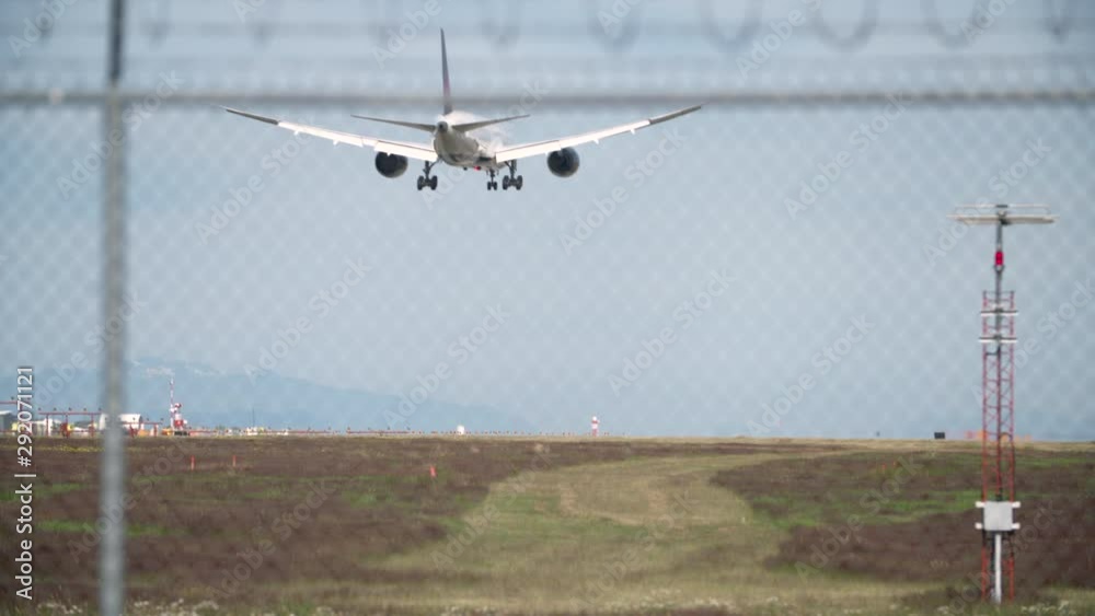 Jet Plane Landing 4K UHD. A jet airplane touching down. Landing gear down. 4K. UHD. Jet Plane Landing 4K UHD. A jet airplane touching down. Landing gear down. 4K. UHD.