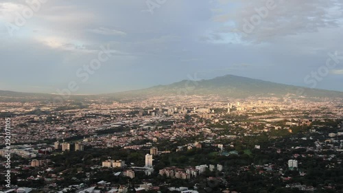 Aerial View of Downtown San Jose, Costa Rica including Escazu, La Sabana, National Stadium, and Irazu Volcano at Sunset photo