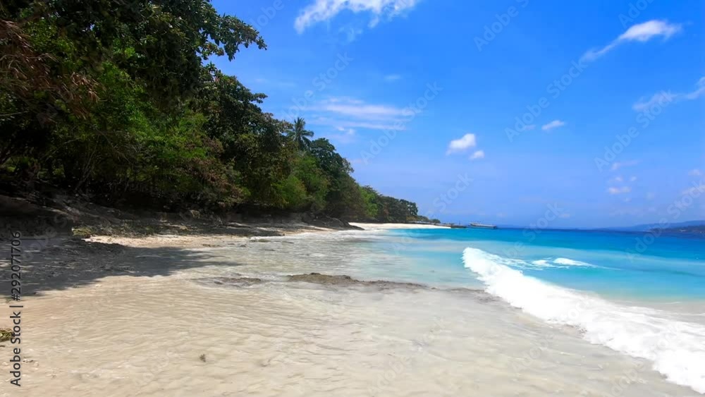 beautiful shoreline with blue waters fine sand and rocky shore beautiful shoreline with blue waters fine sand and rocky shore