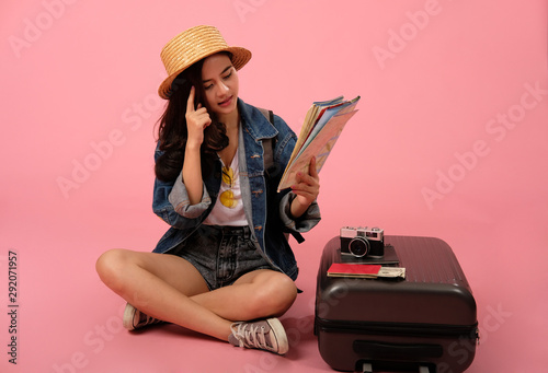woman backpacker traveler with map. journey trip travel. studio shot