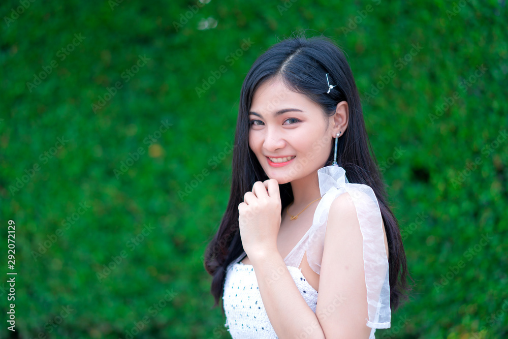 Portrait of Beautiful young woman with summer green park background Portrait of Beautiful young woman with summer green park background