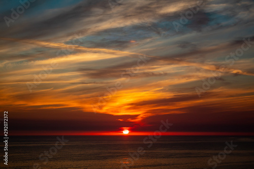 Colorful ocean sunset with beautiful clouds 