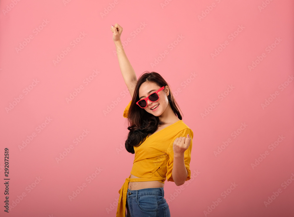 studio portrait of smiling asian woman in casual clothing. studio shot
