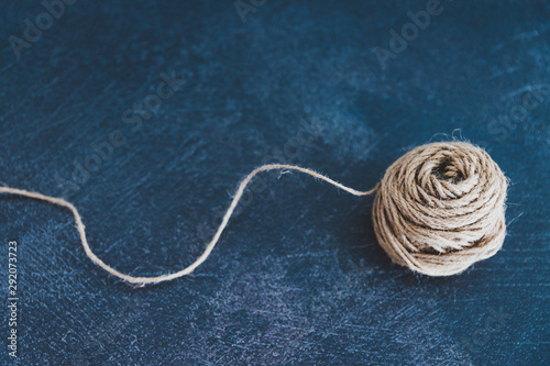 Photography tangled ball of thread with string popping out of it