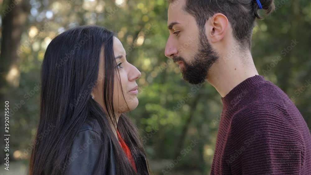 young lovers quarreling in the park,hugging in the park.Love,compassion young lovers quarreling in the park,hugging in the park.Love,compassion