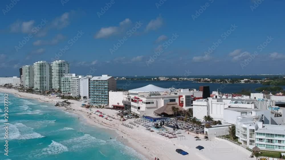Aerial shot of the hotel zone in cancún, in a sunny day hitting the blue waters of the caribbean. Left panning reveal. Aerial shot of the hotel zone in cancún, in a sunny day hitting the blue waters of the caribbean. Left panning reveal.