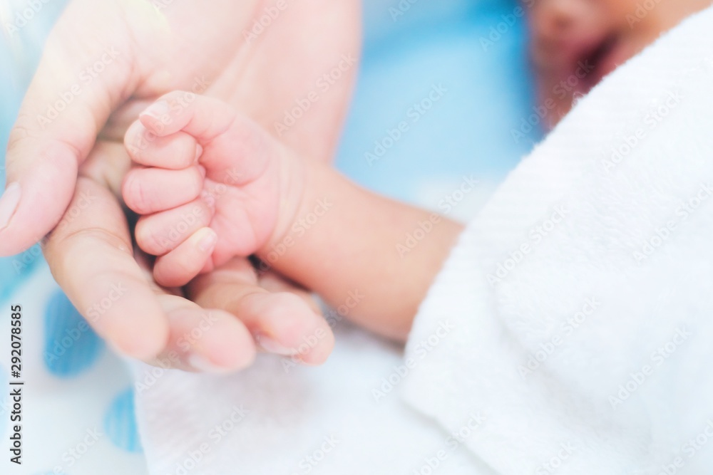 Close up hand of mother holding baby hand. Concept of love and family. Close up hand of mother holding baby hand. Concept of love and family.