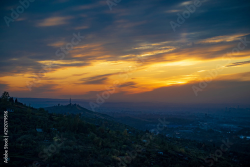 Sunset over the city  view from the hill