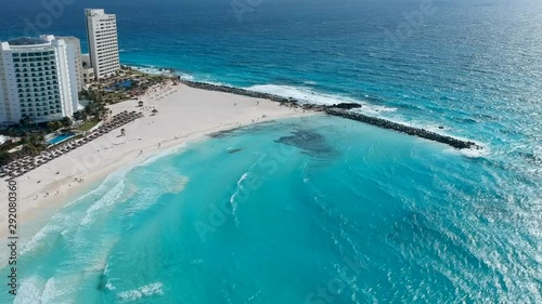 Aerial shot of the hotel zone in cancún, in a sunny day hitting the blue waters of the caribbean. photo