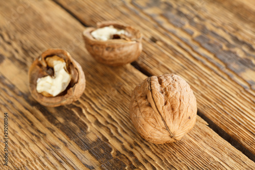 Walnut close-up over the wooden natural background