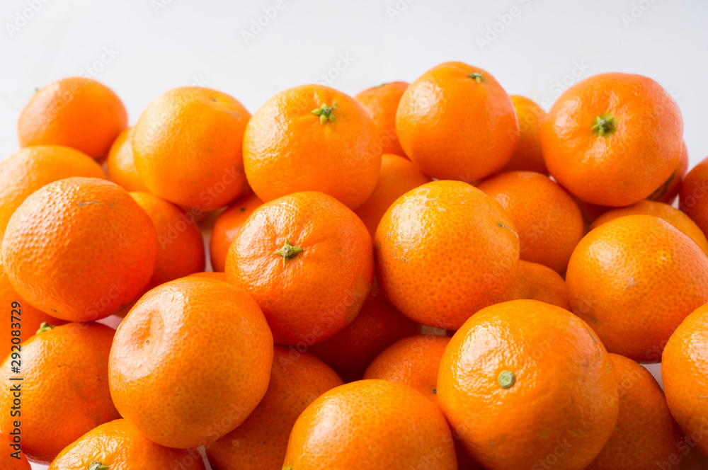 Fresh tangerines. Ripe and tasty mandarins. Clementines. Background tangerines. Fresh tangerines. Ripe and tasty mandarins. Clementines. Background tangerines.