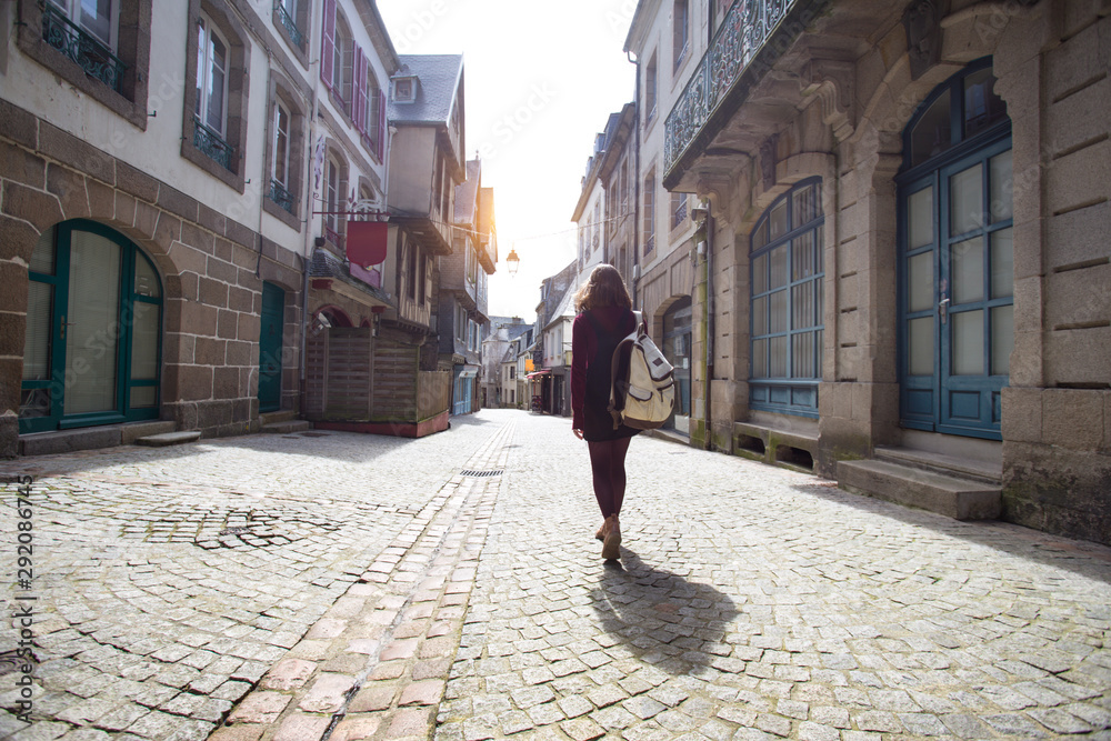 girl is walking in the old town Morlaix