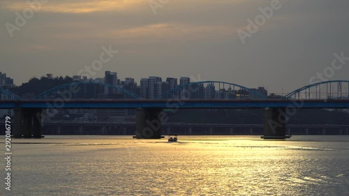 Wallpaper Mural Wide shot of Seoul Dongjak bridge with a solitary boat crossing on sunset Torontodigital.ca