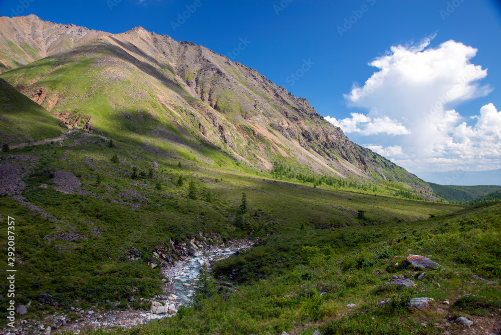  The mountain ranges of Satan and Hamar-Daban. Mountain peaks and valleys. Mountain landscape. The nature of Siberia.