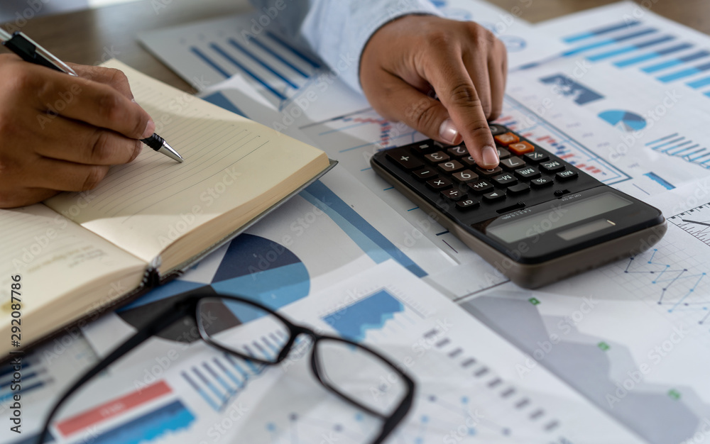 Fototapeta premium businessman work math finances and calculate cost invoice for budget to buy home