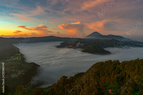 Beautiful view of Mount Bromo volcano during sunrise with white mist at Bromo tengger semeru national park, East Java, Indonesia