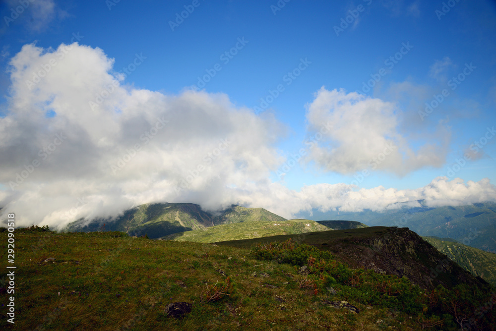The mountain ranges of Satan and Hamar-Daban. Mountain peaks and valleys. Mountain landscape. The nature of Siberia. The mountain ranges of Satan and Hamar-Daban. Mountain peaks and valleys. Mountain landscape. The nature of Siberia.