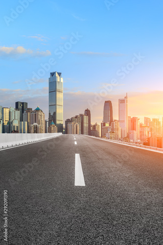 Asphalt highway passes through the city financial district in Chongqing at sunset,China.