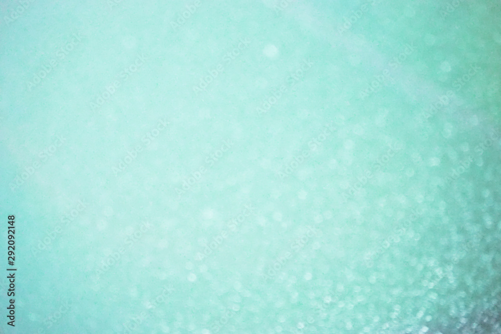Soft defocused blue background with sparkles. Atmosphere of the New Year mood. Soft defocused blue background with sparkles. Atmosphere of the New Year mood.