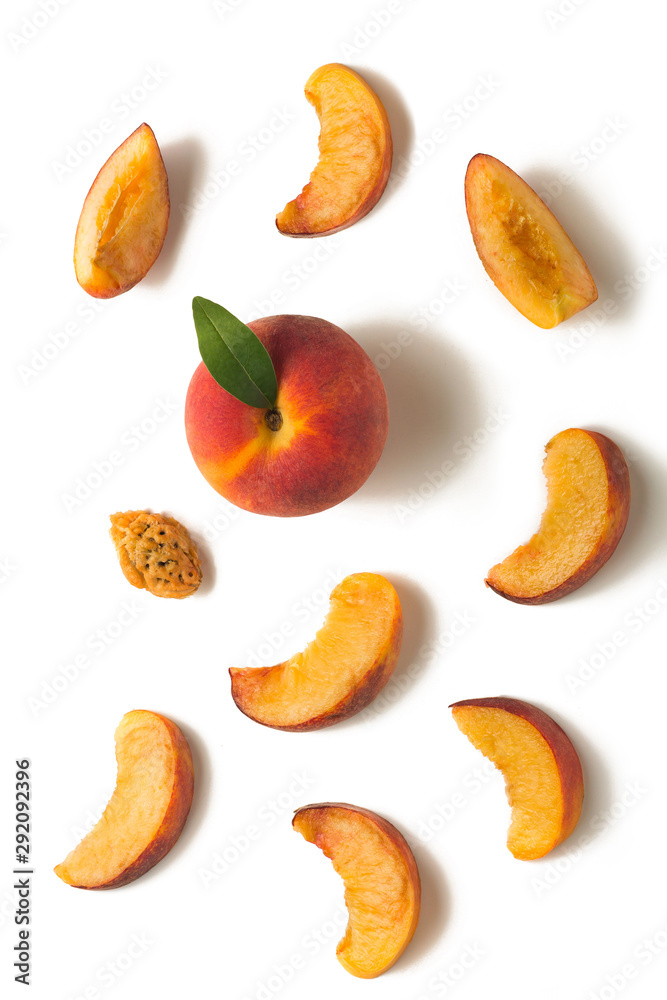 Fruit set. Ripe peach, peach slices, peach kernel on a white background Fruit set. Ripe peach, peach slices, peach kernel on a white background