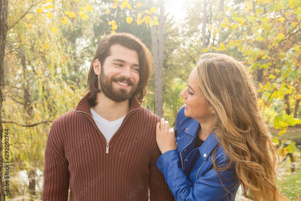 Fototapeta premium Couple in the park enjoying nice autumn time.