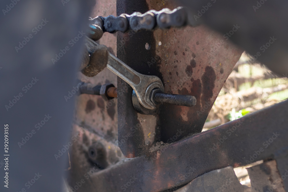 harvest. potatoes. breakdown of a retro tractor. turn the nut with a big wrench. pull the block