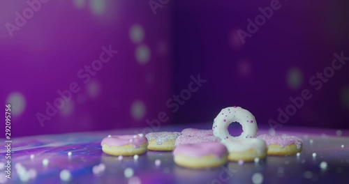 colorful donuts assorted donuts with chocolate frosted, pink glazed and sprinkles donuts photo