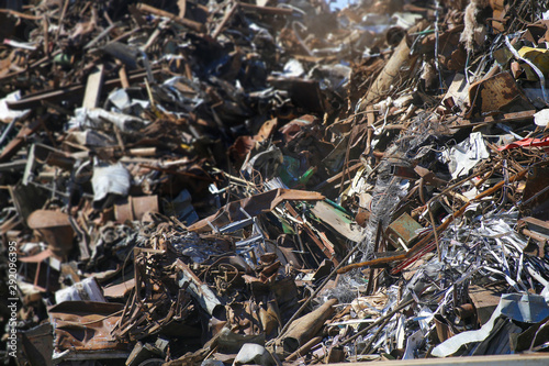Scrap yard, close-up. Foreground sharp, background blurred. Background of rusty scrap metal.