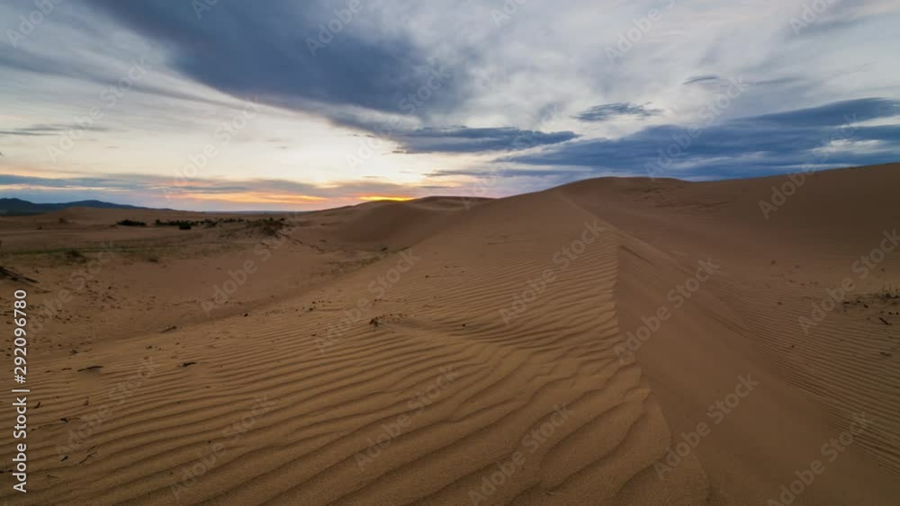 Sunset over the sand dunes in the desert Sunset over the sand dunes in the desert