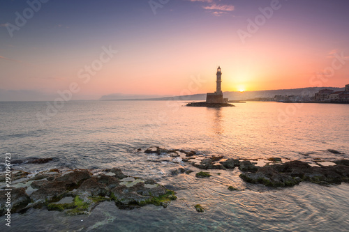 Lighthouse of the old Venetian port in Chania at sunrise, Crete. Greece