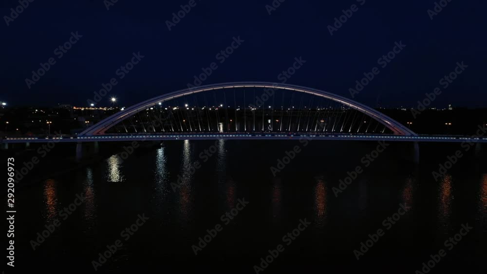 Night shot of a modern Apollo Bridge across river Danube in Bratislava, Slovakia. Zooming in. Night shot of a modern Apollo Bridge across river Danube in Bratislava, Slovakia. Zooming in.