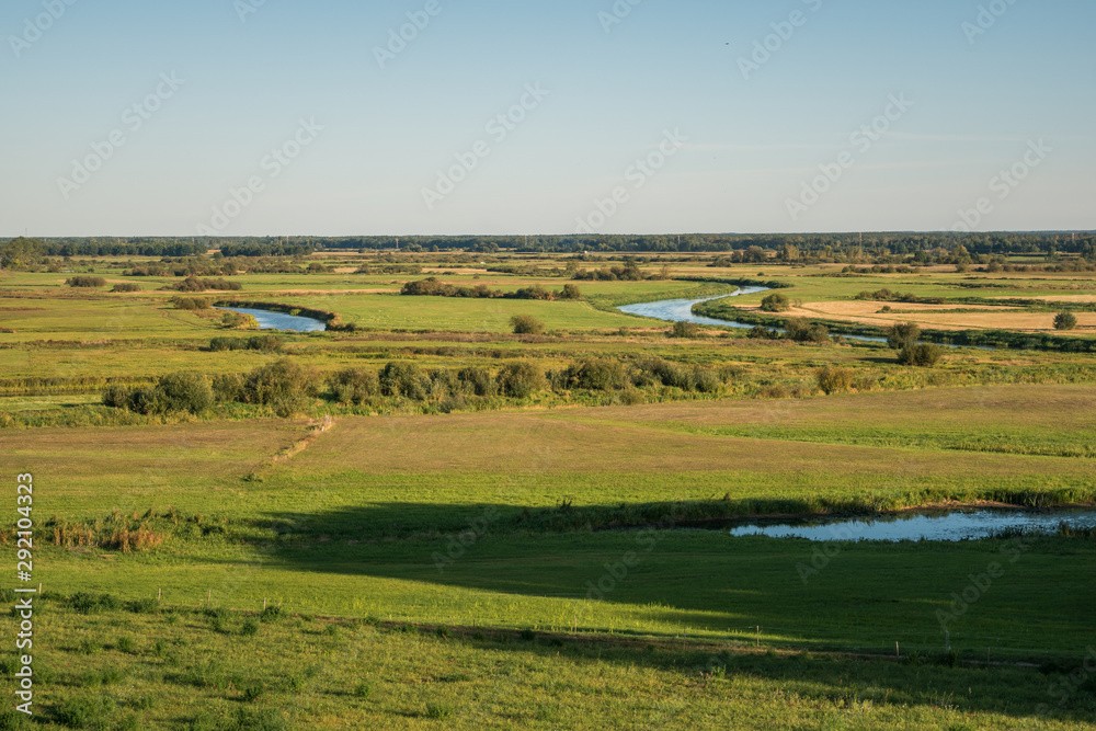 View from the settlement on the Biebrza estuary to Narew in Wizna, Podlaskie, Poland View from the settlement on the Biebrza estuary to Narew in Wizna, Podlaskie, Poland