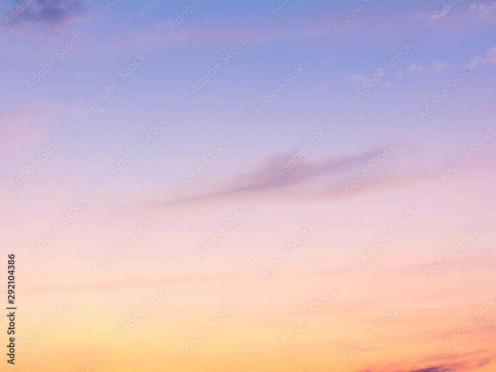 clear orange yellow sky background with blue clouds sunset or sunrise morning abstract texture.