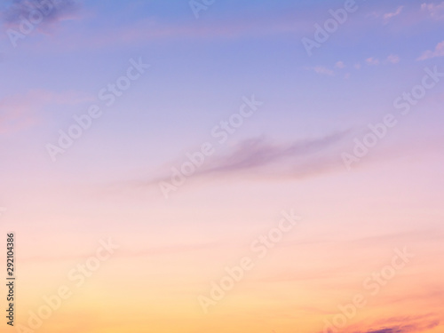Fototapeta Naklejka Na Ścianę i Meble -  clear orange yellow sky background with blue clouds sunset or sunrise morning abstract texture.
