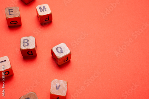 alphabet wood dices on orange background