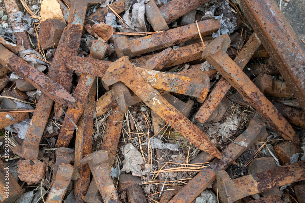 rusty railroad spikes on ground outdoors rusty railroad spikes on ground outdoors