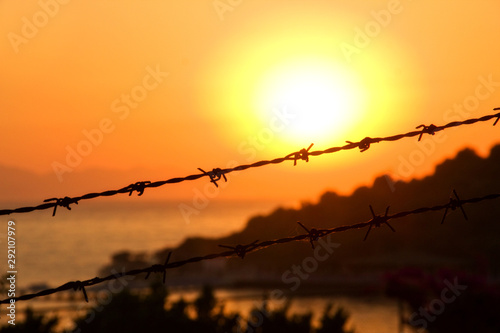 Fototapeta Naklejka Na Ścianę i Meble -  Sunset on fenced beach in Turkey