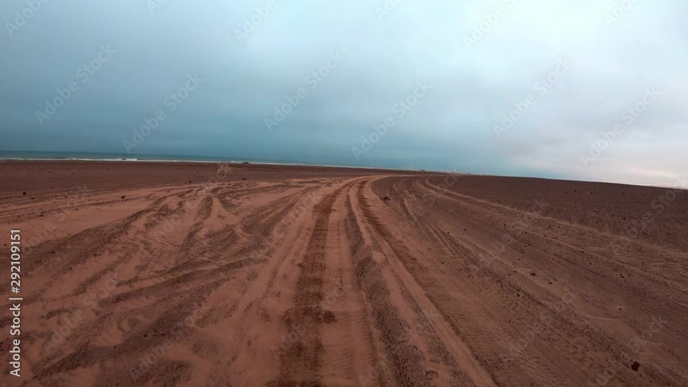 FPV of dune riding and 4x4 driving in sand dunes and on the beach. Shot in the Namibian Skeleton Coast, part of the Namib Desert FPV of dune riding and 4x4 driving in sand dunes and on the beach. Shot in the Namibian Skeleton Coast, part of the Namib Desert
