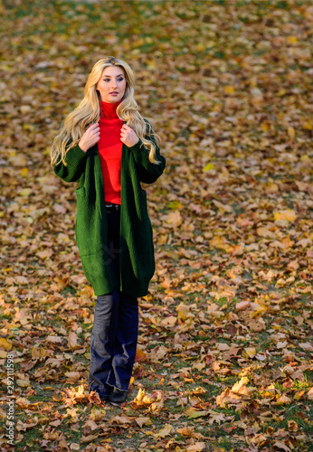 Girl stylish outfit with soft wool or cashmere cardigan. Feel so warm and comfortable. Woman wear long wool cardigan while walk in park. Fall fashion warm cardigan. Autumn fashionable cardigan