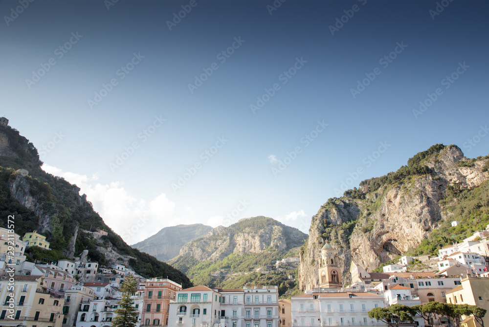cityscape of amalfi and mountains in the background