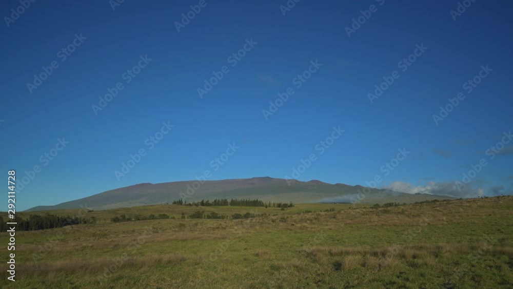 Saddle Road Big Island Roadway side view hills mountains blue sky. Mauna Kea Telescopes Saddle Road Big Island Roadway side view hills mountains blue sky. Mauna Kea Telescopes