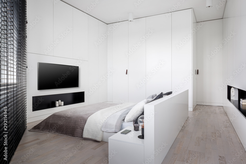 Elegant white bedroom with tv Stock Photo | Adobe Stock