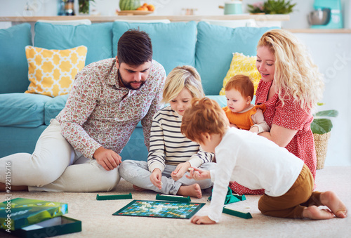 Wallpaper Mural happy family playing board games together at home Torontodigital.ca