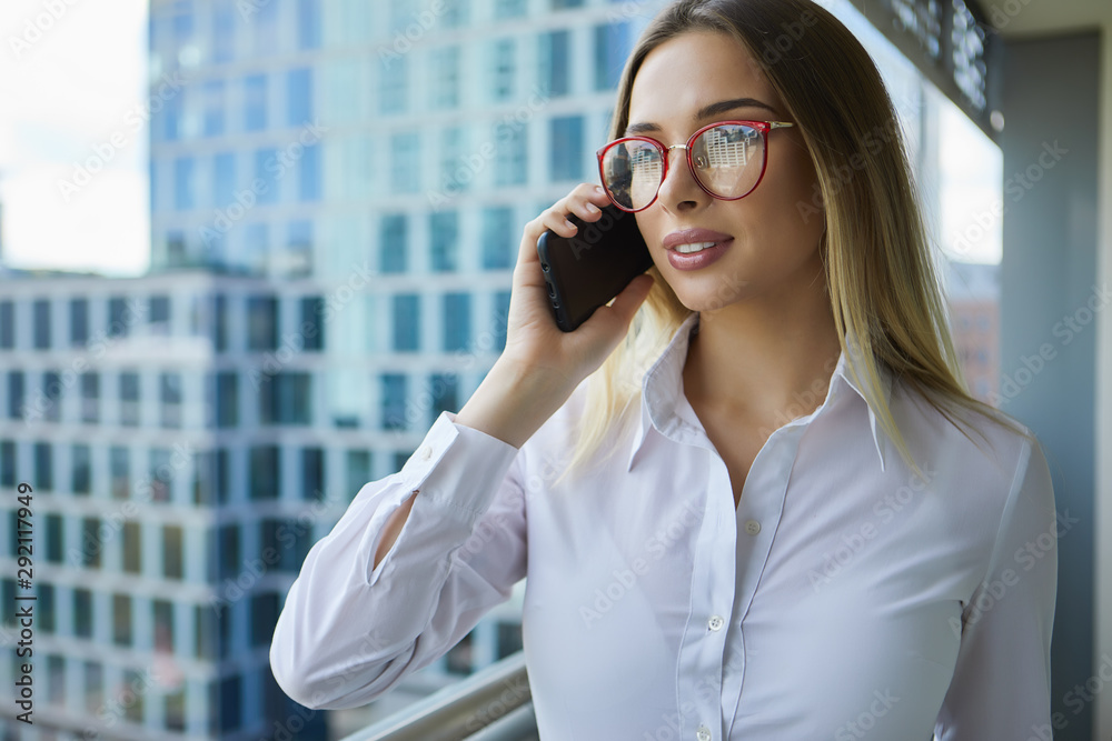 Beautiful business woman on the background of the modern office Beautiful business woman on the background of the modern office