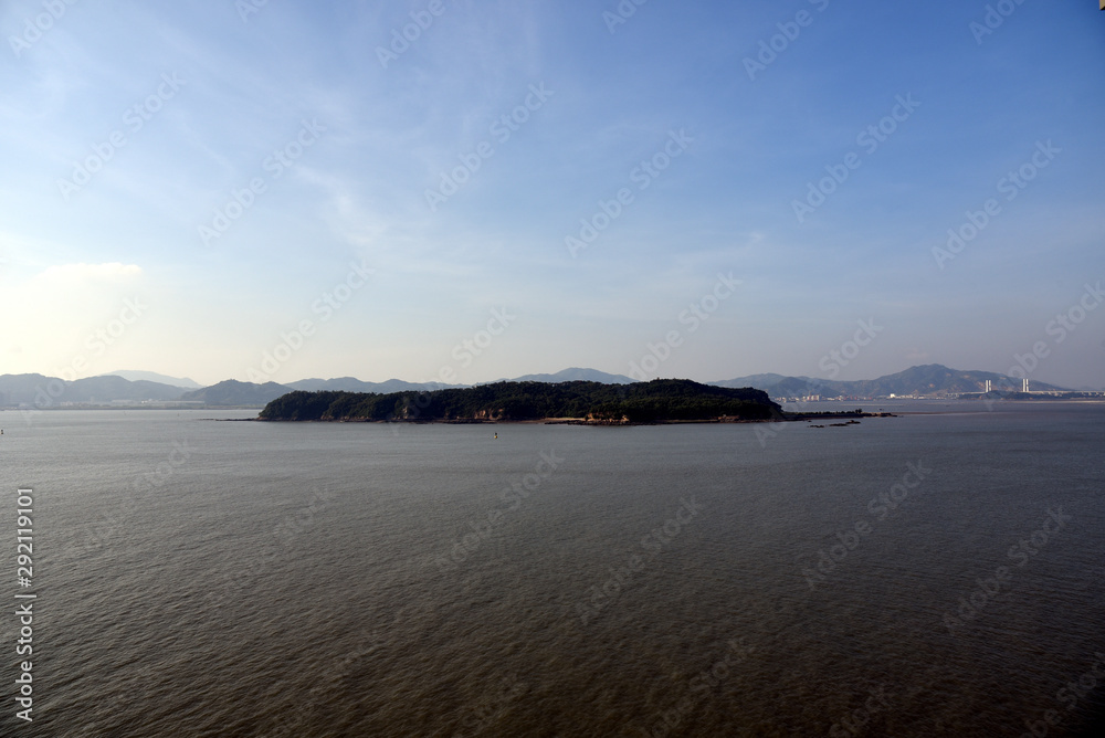 Island on the river - landscape of the Chinese port city Xiamen. 