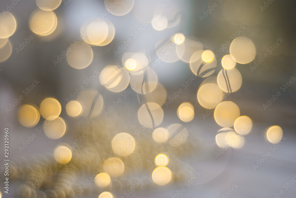 Celebration background with defocused golden lights for Christmas, New Year, Holiday, party