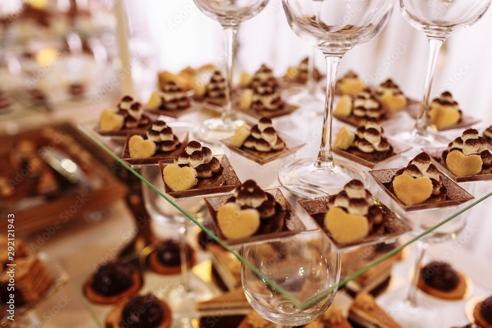 Wedding candy bar with a lot of different desserts. Selective focus. Wedding candy bar with a lot of different desserts. Selective focus.