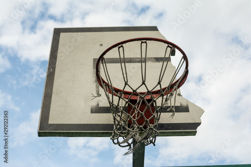 .broken basketball Hoop against the blue sky